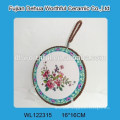 Flower figure ceramic pot mat with red rope